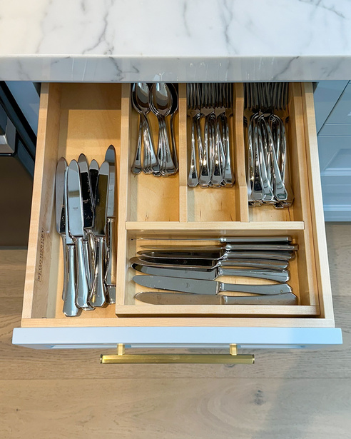Cutlery divider drawer with organized utensils